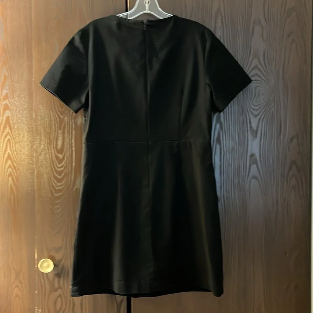 Michael Kors short sleeved black dress with lacing. Size 10.